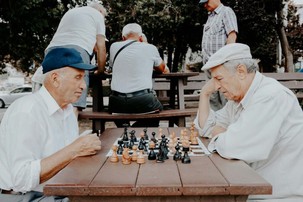 retired friends playing chess